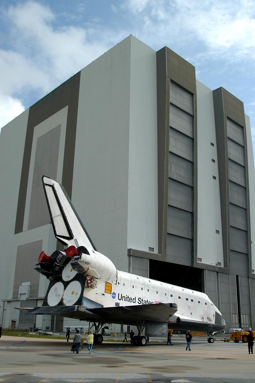 KENNEDY SPACE CENTER, FLA. - The Space Shuttle orbiter Atlantis nears the Vehicle Assembly Building (VAB).  It is being towed from the Orbiter Processing Facility (OPF) to allow work to be performed in the bay that can only be accomplished while it is empty. Work scheduled in the processing facility includes annual validation of the bay's cranes, work platforms, lifting mechanisms, and jack stands. Atlantis will remain in the VAB for about 10 days, then return to the OPF as work resumes to prepare it for launch in September 2004 on the first return-to-flight mission, STS-114.