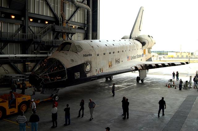 NASA image: KENNEDY SPACE CENTER, FLA. - The Space Shuttle orbiter Atlantis is moved into high bay 4 of the Vehicle Assembly Building (VAB).  It was towed from the Orbiter Processing Facility (OPF) to allow work to be performed in the bay that can only be accomplished while it is empty. Work scheduled in the processing facility includes annual validation of the bay's cranes, work platforms, lifting mechanisms, and jack stands. Atlantis will remain in the VAB for about 10 days, then return to the OPF as work resumes to prepare it for launch in September 2004 on the first return-to-flight mission, STS-114.