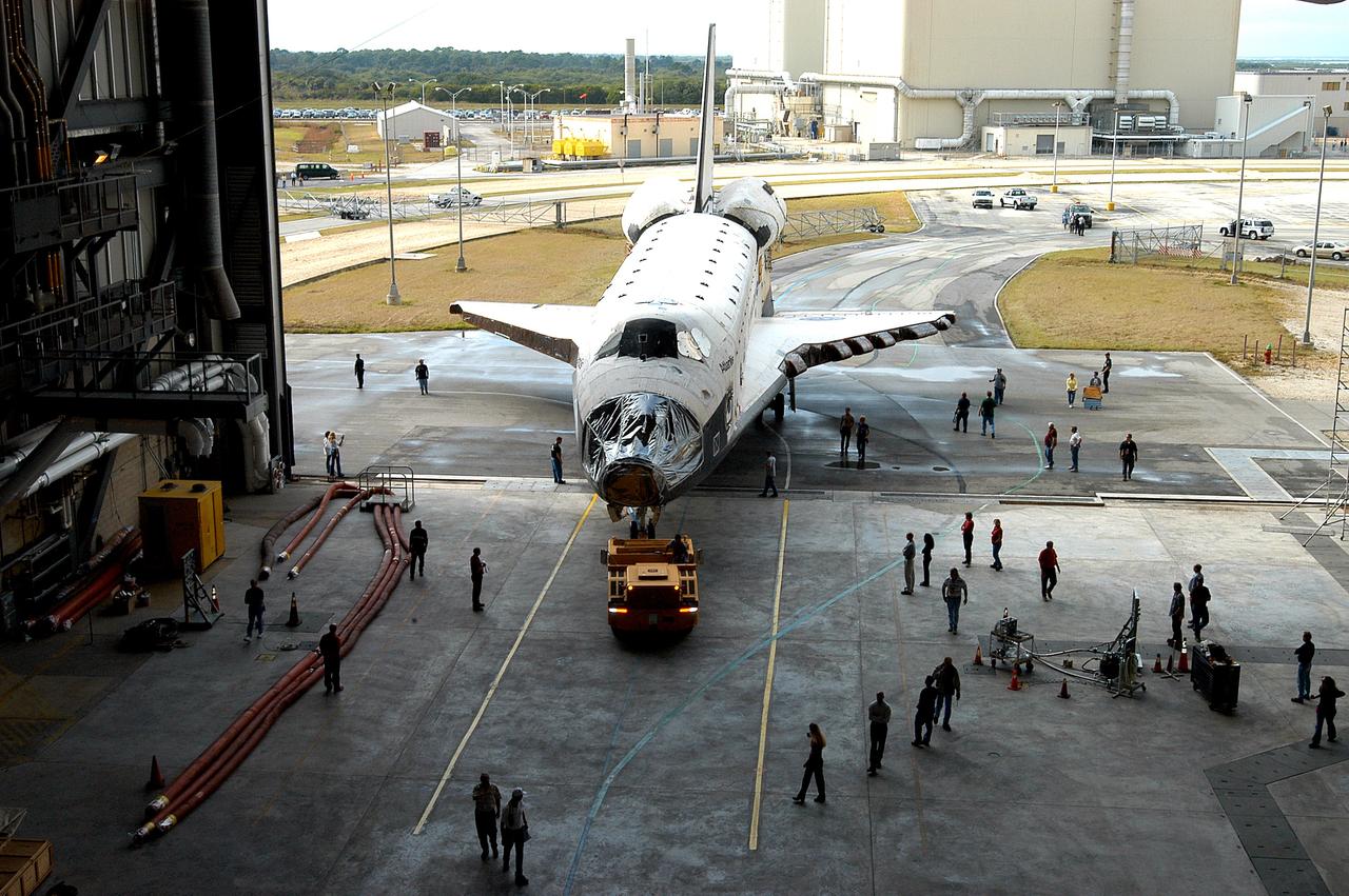 KENNEDY SPACE CENTER, FLA. - The Space Shuttle orbiter Atlantis moves into high bay 4 of the Vehicle Assembly Building (VAB).  It was towed from the Orbiter Processing Facility (OPF) to allow work to be performed in the bay that can only be accomplished while it is empty. Work scheduled in the processing facility includes annual validation of the bay's cranes, work platforms, lifting mechanisms, and jack stands. Atlantis will remain in the VAB for about 10 days, then return to the OPF as work resumes to prepare it for launch in September 2004 on the first return-to-flight mission, STS-114.