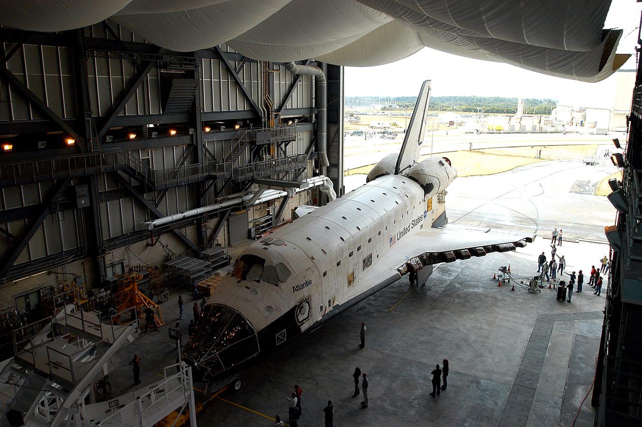 KENNEDY SPACE CENTER, FLA. - The Space Shuttle orbiter Atlantis is almost in position in high bay 4 of the Vehicle Assembly Building (VAB).  It was towed from the Orbiter Processing Facility (OPF) to allow work to be performed in the bay that can only be accomplished while it is empty. Work scheduled in the processing facility includes annual validation of the bay's cranes, work platforms, lifting mechanisms, and jack stands. Atlantis will remain in the VAB for about 10 days, then return to the OPF as work resumes to prepare it for launch in September 2004 on the first return-to-flight mission, STS-114.