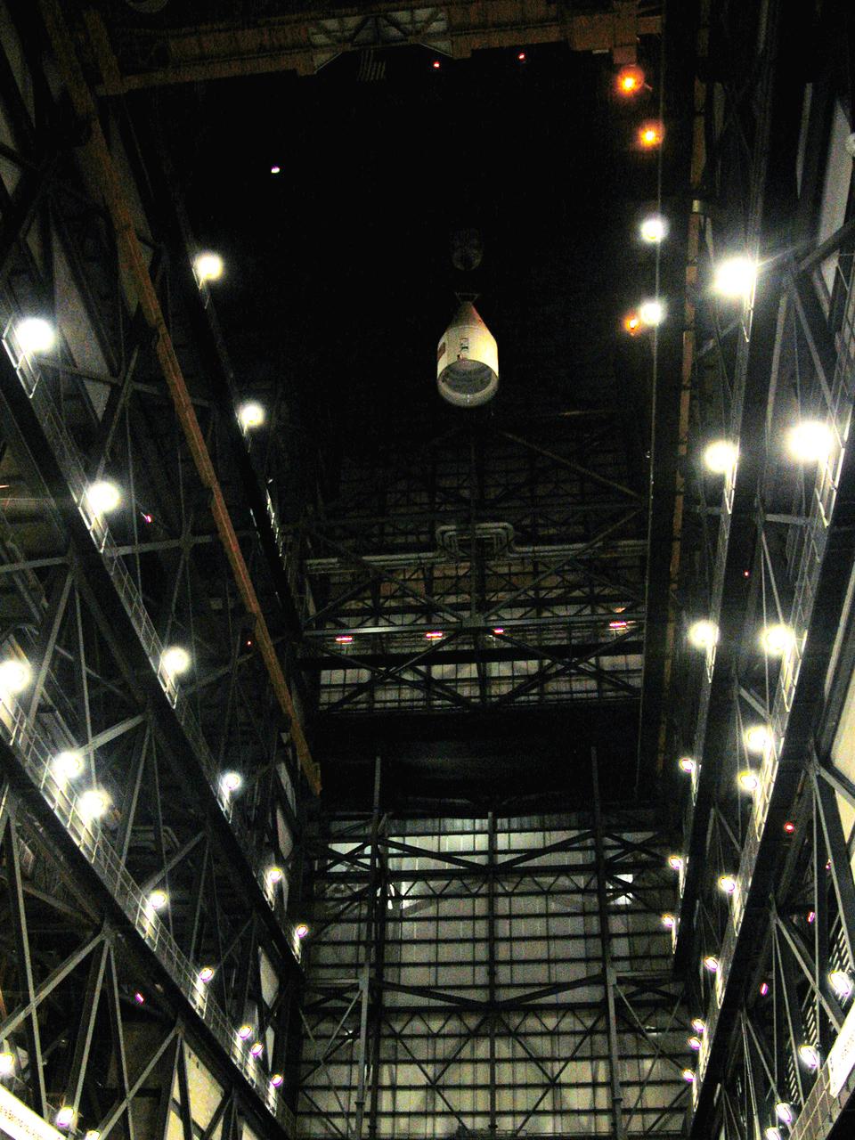 KENNEDY SPACE CENTER, FLA. -  In the Vehicle Assembly Building, after being removed from the solid rocket booster (SRB), the forward assembly is lowered from high above the transfer aisle.  The destacking is part of time and cycle activities.  The SRB was part of the stack on Atlantis originally scheduled for a March 1, 2003, launch on mission STS-114.  The SRBs and external tank were demated in February 2003.   The mission is now scheduled to occur no earlier than Sept. 12, 2004, on Atlantis.