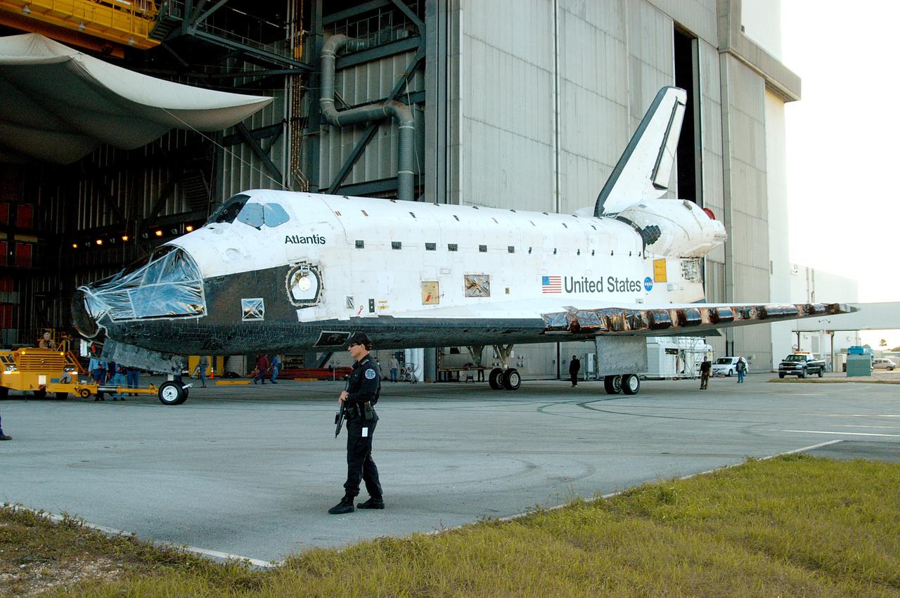 KENNEDY SPACE CENTER, FLA. -- The orbiter Atlantis  is backed away from the Vehicle Assembly Building for transfer back to the Orbiter Processing Facility.  Atlantis spent 10 days in the VAB to allow work to be performed in the OPF that can only be accomplished while the bay is empty. Work included annual validation of the bay's cranes, work platforms, lifting mechanisms and jack stands.  Work resumes to prepare Atlantis for launch in September 2004 on the first return-to-flight mission, STS-114.