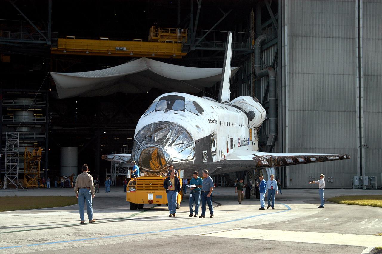 KENNEDY SPACE CENTER, FLA. -  The orbiter Atlantis rolls out of the Vehicle Assembly Building for transfer back to the Orbiter Processing Facility.  Atlantis spent 10 days in the VAB to allow work to be performed in the OPF that can only be accomplished while the bay is empty. Work included annual validation of the bay's cranes, work platforms, lifting mechanisms and jack stands.  Work resumes to prepare Atlantis for launch in September 2004 on the first return-to-flight mission, STS-114.
