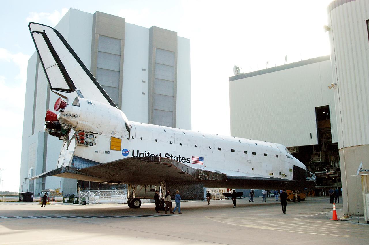 KENNEDY SPACE CENTER, FLA. -  The orbiter Atlantis rolls toward the Orbiter Processing Facility after spending 10 days in the Vehicle Assembly Building.  The hiatus in the VAB allowed work to be performed in the OPF that can only be accomplished while the bay is empty. Work included annual validation of the bay's cranes, work platforms, lifting mechanisms and jack stands.  Work resumes to prepare Atlantis for launch in September 2004 on the first return-to-flight mission, STS-114.