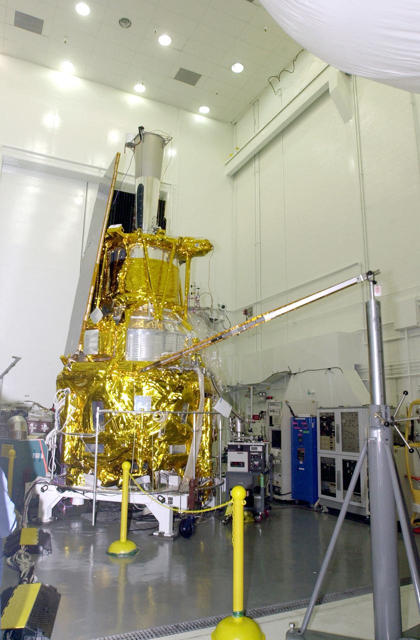 VANDENBERG AFB, CALIF. - In the NASA spacecraft processing facility on North Vandenberg Air Force Base, the Gravity Probe B spacecraft is seen with two solar array panels installed. Installing each array is a 3-day process and includes a functional deployment test. The Gravity Probe B mission is a relativity experiment developed by NASA’s Marshall Space Flight Center, Stanford University and Lockheed Martin. The spacecraft will test two extraordinary predictions of Albert Einstein’s general theory of relativity that he advanced in 1916: the geodetic effect (how space and time are warped by the presence of the Earth) and frame dragging (how Earth’s rotation drags space and time around with it). Gravity Probe B consists of four sophisticated gyroscopes that will provide an almost perfect space-time reference system. The mission will look in a precision manner for tiny changes in the direction of spin.
