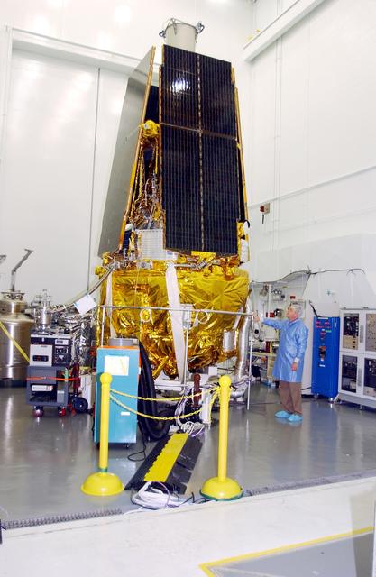 NASA image: VANDENBERG AFB, CALIF. -  In the NASA spacecraft processing facility on North Vandenberg Air Force Base, the Gravity Probe B spacecraft is seen with all four solar array panels installed.  Installing each array is a 3-day process and includes a functional deployment test.  The Gravity Probe B mission is a relativity experiment developed by NASA’s Marshall Space Flight Center, Stanford University and Lockheed Martin.  The spacecraft will test two extraordinary predictions of Albert Einstein’s general theory of relativity that he advanced in 1916: the geodetic effect (how space and time are warped by the presence of the Earth) and frame dragging (how Earth’s rotation drags space and time around with it).  Gravity Probe B consists of four sophisticated gyroscopes that will provide an almost perfect space-time reference system.  The mission will look in a precision manner for tiny changes in the direction of spin.
