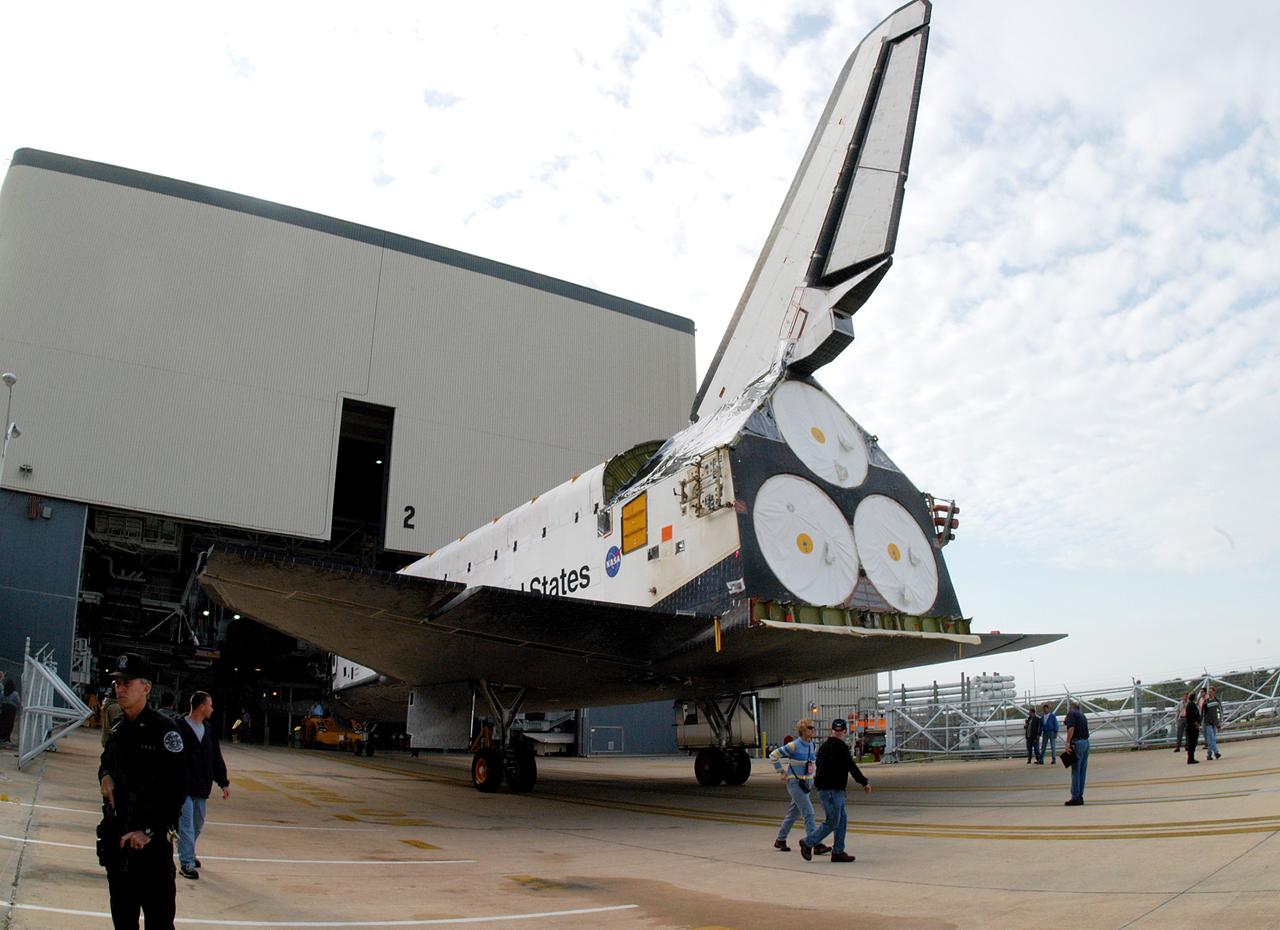KENNEDY SPACE CENTER, FLA. -- Endeavour backs out of the Orbiter Processing Facility for temporary transfer to the Vehicle Assembly Building. The move allows work to be performed in the OPF that can only be accomplished while the bay is empty. Work scheduled in the OPF includes annual validation of the bay’s cranes, work platforms, lifting mechanisms and jack stands. Endeavour will remain in the VAB for approximately 12 days, then return to the OPF.