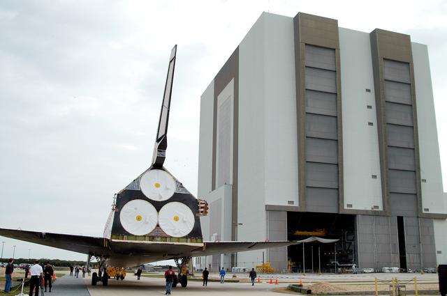 NASA image: KENNEDY SPACE CENTER, FLA. -- Endeavour is towed toward the Vehicle Assembly Building for temporary storage.  The orbiter has been moved from the Orbiter Processing Facility (OPF) to allow work to be performed in the OPF that can only be accomplished while the bay is empty. Work scheduled in the OPF includes annual validation of the bay’s cranes, work platforms, lifting mechanisms and jack stands. Endeavour will remain in the VAB for approximately 12 days, then return to the OPF.