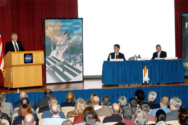 NASA image: KENNEDY SPACE CENTER, FLA. -- Center Director Jim Kennedy introduces U.S. Reps. Dave Weldon and Tom Feeney in a Town Hall meeting at KSC.  Weldon and Feeney commented on the new mission for NASA outlined by President George W. Bush Jan. 14.  The congressmen and Kennedy also answered questions from employees in the audience.