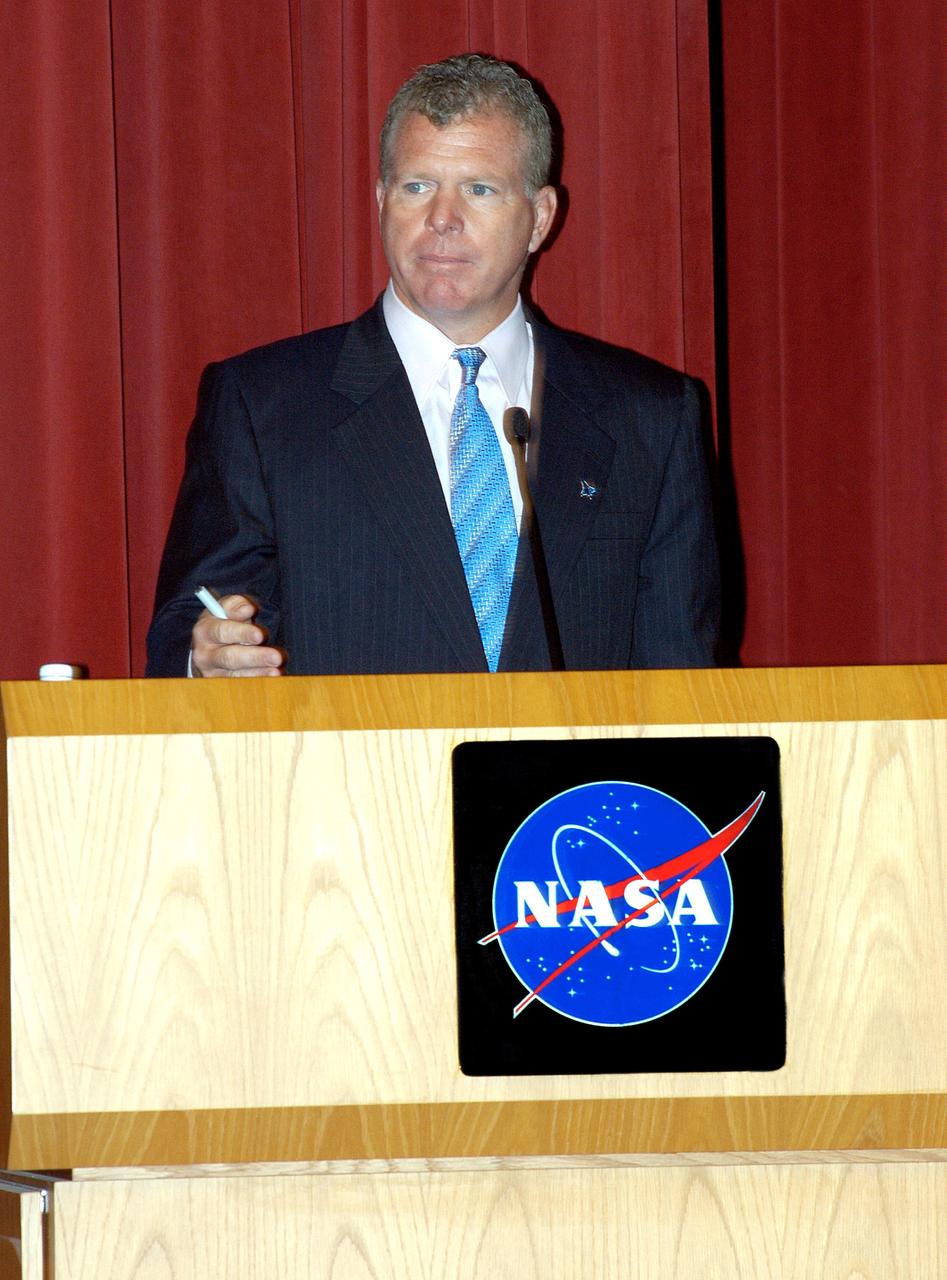 KENNEDY SPACE CENTER, FLA. -- U.S. Rep. Tom Feeney addresses employees in a Town Hall meeting at KSC with comments on the new mission for NASA outlined by President George W. Bush Jan. 14.  He shared the stage with U.S. Rep. Dave Weldon and Center Director Jim Kennedy. All three later answered questions from employees in the audience.