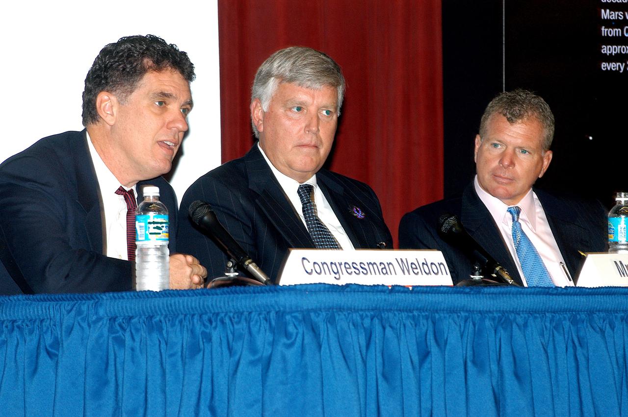 KENNEDY SPACE CENTER, FLA. -- In a Town Hall meeting at KSC, Center Director Jim Kennedy (center) joined U.S. Reps. Dave Weldon (left) and Tom Feeney (right) to discuss the new mission for NASA outlined by President George W. Bush Jan. 14.  The congressmen and Kennedy also answered questions from employees in the audience.