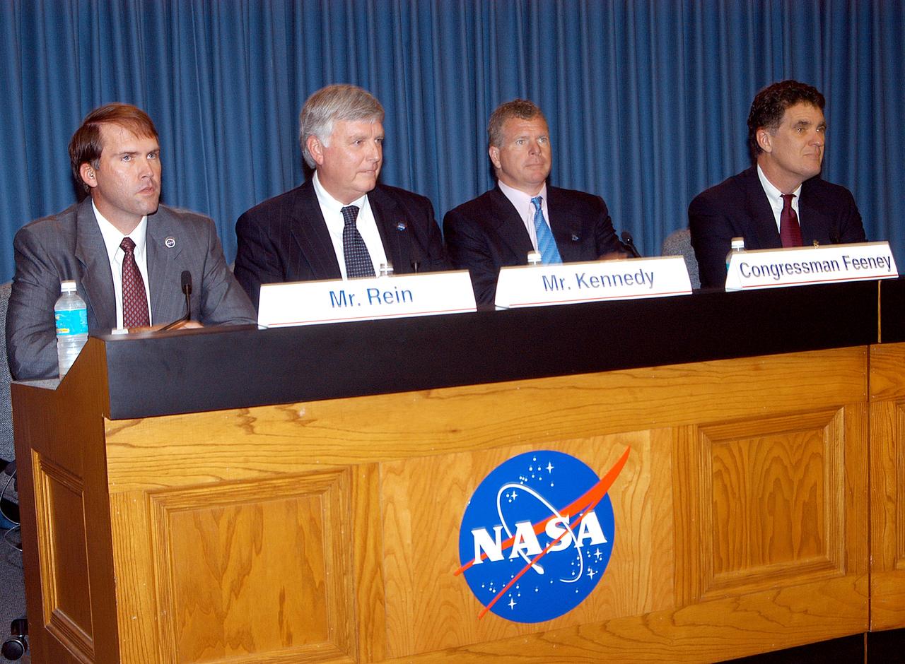 KENNEDY SPACE CENTER, FLA. -- Mike Rein (at left), division chief of KSC External Affairs, moderates the press conference featuring (second from left to right) U.S. Rep. Tom Feeney, Center Director Jim Kennedy and U.S. Rep. Dave Weldon.  The media were interested in hearing Kennedy’s and the congressmen’s reactions to the new mission for NASA outlined by President George W. Bush Jan. 14.