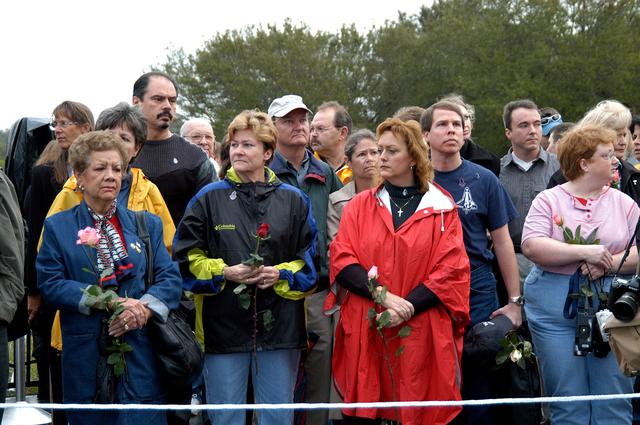 NASA image: KENNEDY SPACE CENTER, FLA. -  Friends, co-workers and families gather at the Space Memorial Mirror for KSC’s special service remembering and honoring the crew of Columbia.  Feb. 1 is the one-year anniversary of the loss of the crew and orbiter Columbia in a tragic accident as the ship returned to Earth following mission STS-107.  The public was invited to the memorial service held at the KSC Visitor Complex.  Participants included Center Director Jim Kennedy, Deputy Director Woodrow Whitlow Jr., Executive Director of Florida Space Authority Winston Scott, Dr. Stephen Feldman, president of the Astronaut Memorial Foundation, and dancers from the Shoshone-Bannock Native American community in Fort Hall, Idaho.