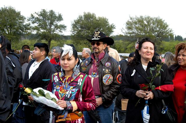NASA image: KENNEDY SPACE CENTER, FLA. -  Friends, co-workers and families gather at the Space Memorial Mirror for KSC’s special service remembering and honoring the crew of Columbia.  Feb. 1 is the one-year anniversary of the loss of the crew and orbiter Columbia in a tragic accident as the ship returned to Earth following mission STS-107.  The public was invited to the memorial service held at the KSC Visitor Complex.  Participants included Center Director Jim Kennedy, Deputy Director Woodrow Whitlow Jr., Executive Director of Florida Space Authority Winston Scott, Dr. Stephen Feldman, president of the Astronaut Memorial Foundation, and dancers from the Shoshone-Bannock Native American community in Fort Hall, Idaho.