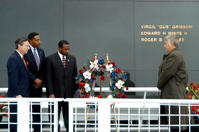 NASA image: KENNEDY SPACE CENTER, FLA. -  During a memorial service remembering and honoring the crew of Columbia, President of the Astronaut Memorial Foundation Dr. Stephen Feldman, Executive Director of Florida Space Authority Winston Scott, KSC Deputy Director Woodrow Whitlow Jr. and Center Director Jim Kennedy pause after placing a wreath in front of the Space Memorial Mirror.  Feb. 1 is the one-year anniversary of the loss of the crew and orbiter Columbia in a tragic accident as the ship returned to Earth following mission STS-107.  Scott is a former astronaut who flew on Columbia in 1997. The public was also invited to the memorial service.