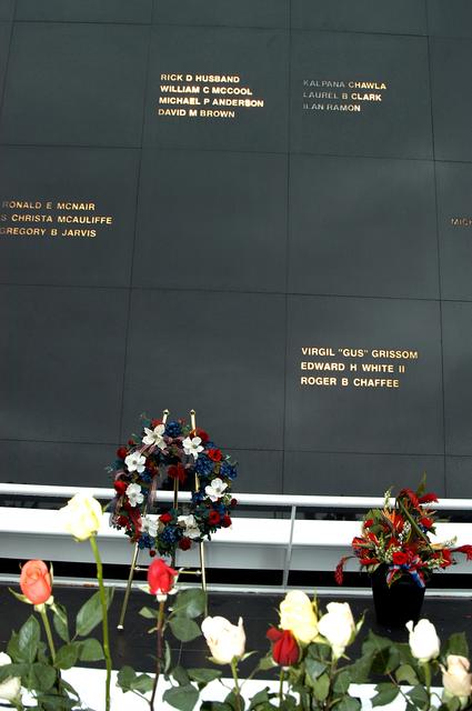 KENNEDY SPACE CENTER, FLA. -  Roses and a floral wreath adorn the Space Memorial Mirror following a memorial service for the crew of Columbia.  Feb. 1 is the one-year anniversary of the loss of the crew and orbiter Columbia in a tragic accident as the ship returned to Earth following mission STS-107. The public was invited to the memorial service, which included comments by Center Director Jim Kennedy and Executive Director of Florida Space Authority Winston Scott.  Scott is a former astronaut who flew on Columbia in 1997.