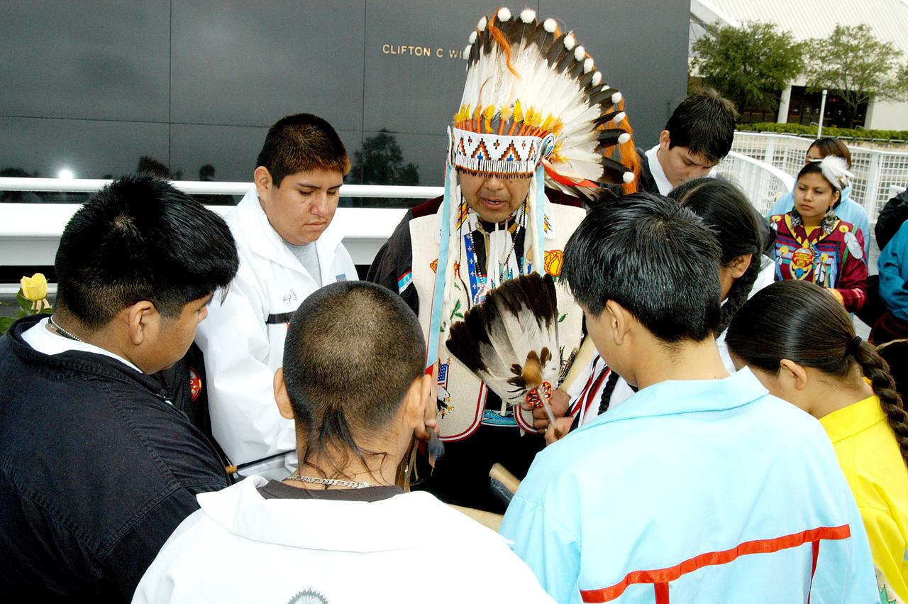 KENNEDY SPACE CENTER, FLA. - Dancers from the Shoshone-Bannock Junior-Senior High School, Fort Hall, Idaho, perform a healing ceremony during the memorial service held at the Space Memorial Mirror for the crew of Columbia.  Feb. 1 is the one-year anniversary of the loss of the crew and orbiter Columbia in a tragic accident as the ship returned to Earth following mission STS-107.  Students and staff of the Shoshone-Bannock Nation had an experiment on board Columbia. The public was invited to the memorial service, held in the KSC Visitor Complex, which included comments by Center Director Jim Kennedy and Executive Director of Florida Space Authority Winston Scott.  Scott is a former astronaut who flew on Columbia in 1997.