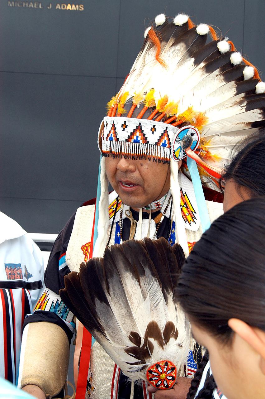 KENNEDY SPACE CENTER, FLA. - Dancers from the Shoshone-Bannock Junior-Senior High School, Fort Hall, Idaho, perform a healing ceremony during the memorial service held at the Space Memorial Mirror for the crew of Columbia.  Feb. 1 is the one-year anniversary of the loss of the crew and orbiter Columbia in a tragic accident as the ship returned to Earth following mission STS-107.  Students and staff of the Shoshone-Bannock Nation had an experiment on board Columbia. The public was invited to the memorial service, held in the KSC Visitor Complex, which included comments by Center Director Jim Kennedy and Executive Director of Florida Space Authority Winston Scott.  Scott is a former astronaut who flew on Columbia in 1997.