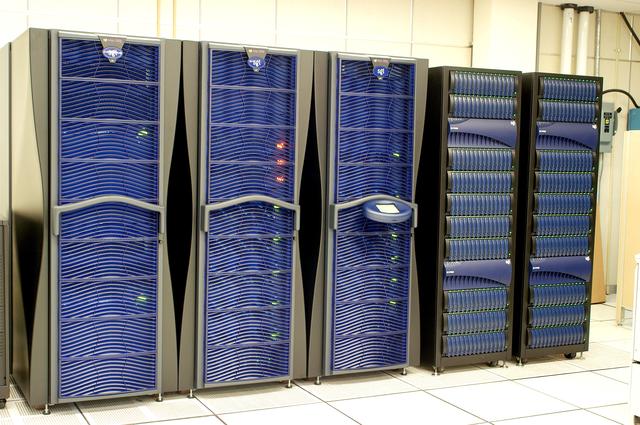 NASA image: KENNEDY SPACE CENTER, FLA. - These towers are part of one of the world’s highest performing visual film analysis systems, developed to review and analyze previous shuttle flight data in preparation for the shuttle fleet’s return to flight.  The system is being used today for another purpose.  NASA has permitted its use in helping to analyze a film that shows a recent kidnapping in progress in Florida.  Developed by NASA, United Space Alliance (USA) and Silicon Graphics Inc., the system allows multiple-person collaboration,  highly detailed manipulation and evaluation of specific imagery.  The system is housed in the Image Analysis Facility inside the Vehicle Assembly Building. [Photo taken Aug. 15, 2003, courtesy of Terry Wallace, SGI ]