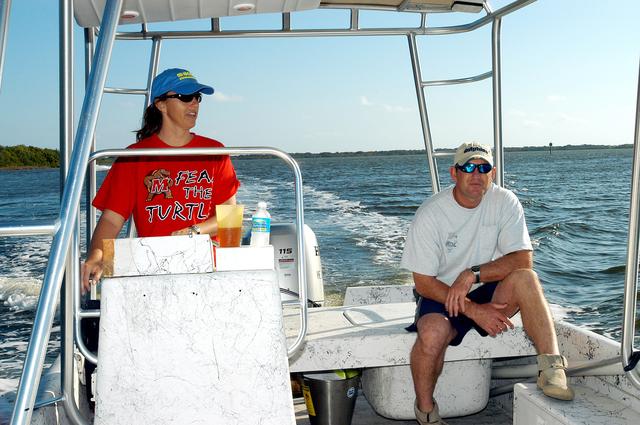 NASA image: KENNEDY SPACE CENTER, FLA. - Karen Holloway-Adkins, KSC wildlife specialist, takes the helm on the boat as she begins a tour of the Banana River.  She is studying the life history of sea turtles, especially what they eat, where they lay their eggs and what factors might harm their survival.  On the boat trip she is also monitoring the growth of sea grasses and algae and the water quality of estuaries and lagoons used by sea turtles and other aquatic wildlife.