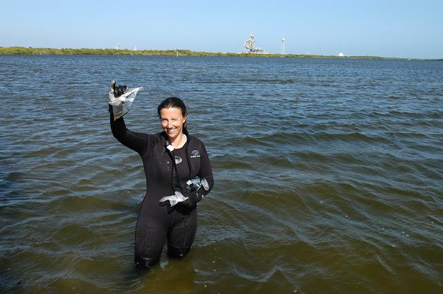 NASA image: KENNEDY SPACE CENTER, FLA. - Karen Holloway-Adkins, KSC wildlife specialist, shows a sample of the sea grass she collected from the floor of the Banana River.  She is studying the life history of sea turtles, especially what they eat, where they lay their eggs and what factors might harm their survival.  On the boat trip she is also monitoring the growth of sea grasses and algae and the water quality of estuaries and lagoons used by sea turtles and other aquatic wildlife.