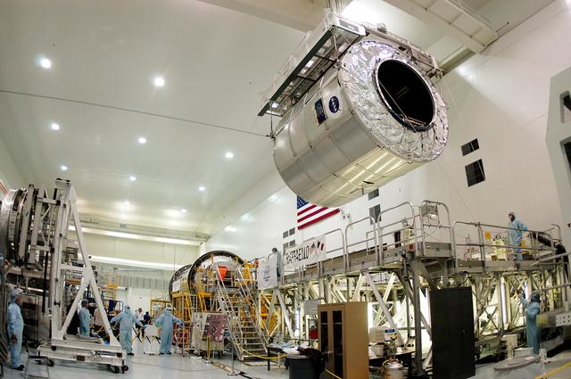 NASA image: KENNEDY SPACE CENTER, FLA. - The Multi-Purpose Logistics Module Raffaello moves away from its stand in the Space Station Processing Facility.  Raffaello is the second MPLM built by the Italian Space Agency, serving as a reusable logistics carrier and primary delivery system to resupply and return station cargo requiring a pressurized environment.  It is being moved to allow the third MPLM, Donatello, to be brought in for routine testing.  Donatello has been stored in the Operations and Checkout Building.  This is the first time all three MPLMs are in the SSPF; the other one is the Leonardo.  Raffaello is scheduled to fly on Space Shuttle Atlantis on mission STS-114.