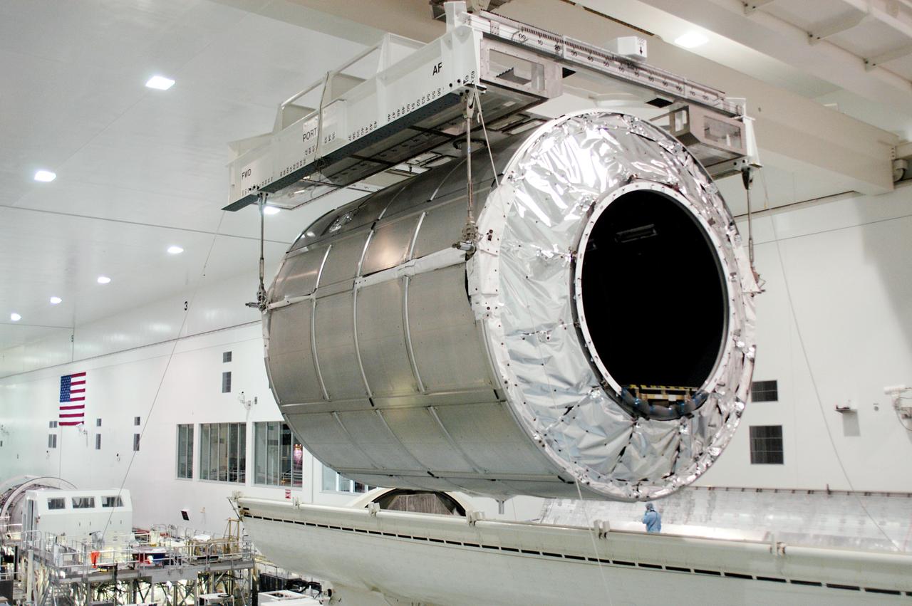 KENNEDY SPACE CENTER, FLA. - The Multi-Purpose Logistics Module Donatello is moved away from the payload canister in the Space Station Processing Facility.  Previously housed in the Operations and Checkout Building, Donatello was brought into the SSPF for routine testing.  This is the first time all three MPLMs (Donatello, Raffaello and Leonardo) are in the SSPF.  The MPLMs were built by the Italian Space Agency, to serve as reusable logistics carriers and the primary delivery system to resupply and return station cargo requiring a pressurized environment.  The third MPLM, Raffaello is scheduled to fly on Space Shuttle Atlantis on mission STS-114.