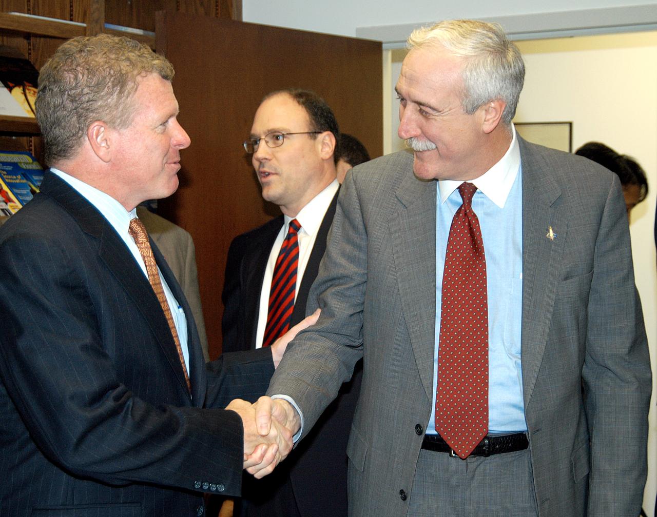 KENNEDY SPACE CENTER, FLA. - NASA Administrator Sean O’Keefe (right) greets Florida Congressman Tom Feeney during a tour of the Central Florida Research Park, near Orlando.  Central Florida leaders are proposing the research park as the site for the new NASA Shared Services Center.  The center would centralize NASA’s payroll, accounting, human resources, facilities and procurement offices that are now handled at each field center.  The consolidation is part of the One NASA focus.  Six sites around the U.S. are under consideration by NASA.