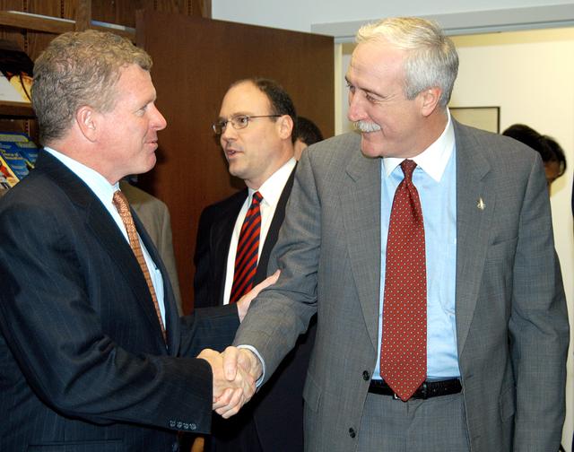 NASA image: KENNEDY SPACE CENTER, FLA. - NASA Administrator Sean O’Keefe (right) greets Florida Congressman Tom Feeney during a tour of the Central Florida Research Park, near Orlando.  Central Florida leaders are proposing the research park as the site for the new NASA Shared Services Center.  The center would centralize NASA’s payroll, accounting, human resources, facilities and procurement offices that are now handled at each field center.  The consolidation is part of the One NASA focus.  Six sites around the U.S. are under consideration by NASA.