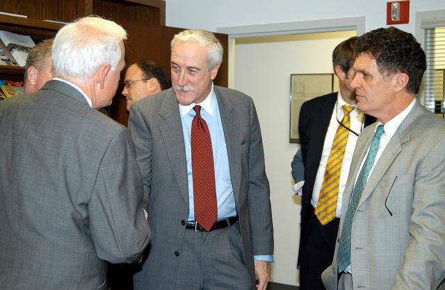 NASA image: KENNEDY SPACE CENTER, FLA. - NASA Administrator Sean O’Keefe  (center) is welcomed to the Central Florida Research Park, near Orlando.  Central Florida leaders are proposing the research park as the site for the new NASA Shared Services Center.  The center would centralize NASA’s payroll, accounting, human resources, facilities and procurement offices that are now handled at each field center.  The consolidation is part of the One NASA focus.  Six sites around the U.S. are under consideration by NASA.