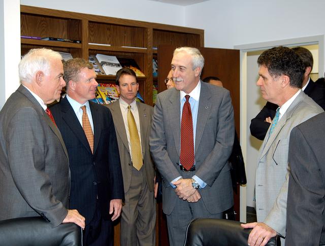 NASA image: KENNEDY SPACE CENTER, FLA. - NASA Administrator Sean O’Keefe (center) listens to Congressman Tom Feeney (second from left) during a tour of the Central Florida Research Park, near Orlando.  At right is U.S. Congressman Dave Weldon.  Central Florida leaders are proposing the research park as the site for the new NASA Shared Services Center.  The center would centralize NASA’s payroll, accounting, human resources, facilities and procurement offices that are now handled at each field center.  The consolidation is part of the One NASA focus.  Six sites around the U.S. are under consideration by NASA.