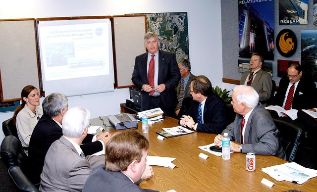 NASA image: KENNEDY SPACE CENTER, FLA. - KSC Director Jim Kennedy makes a presentation to NASA and other officials about the benefits of locating NASA’s new Shared Services Center in the Central Florida Research Park, near Orlando.  At the far left is Pamella J. Dana, Ph.D., director, Office of Tourism, Trade, and Economic Development in Florida.  Central Florida leaders are proposing the research park as the site for the NASA Shared Services Center.  The center would centralize NASA’s payroll, accounting, human resources, facilities and procurement offices that are now handled at each field center.  The consolidation is part of the One NASA focus.  Six sites around the U.S. are under consideration by NASA.