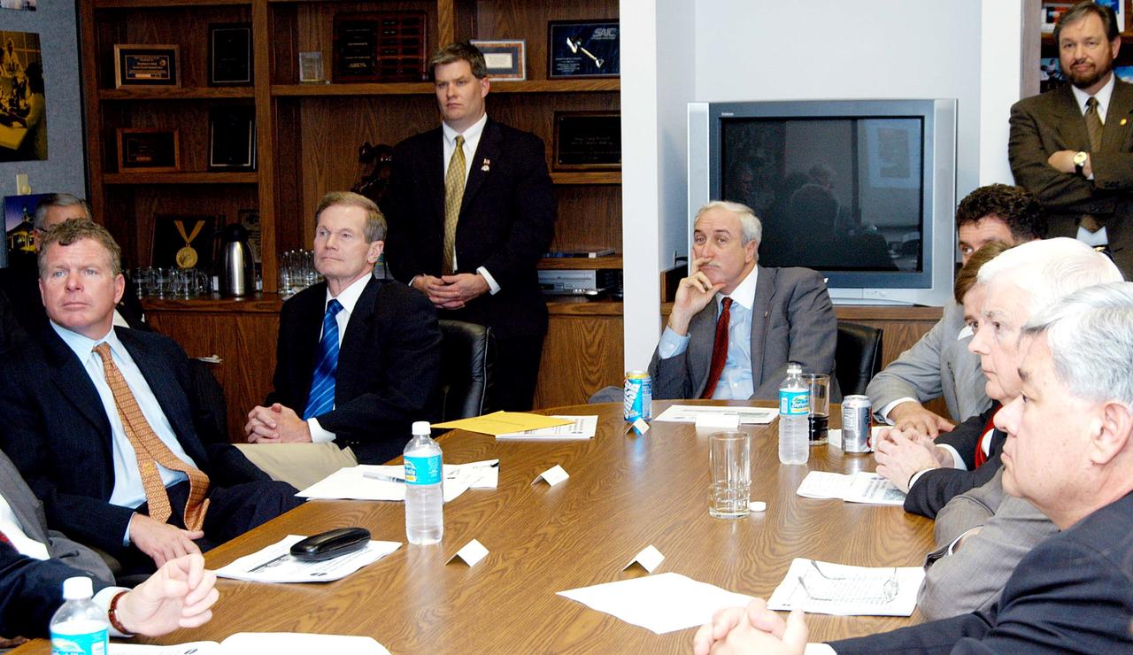 KENNEDY SPACE CENTER, FLA. - NASA officials and government representatives are gathered to learn about the assets of the Central Florida Research Park, near Orlando.  At the far end of the table is NASA Administrator Sean O’Keefe.  He is flanked, on the left, by Florida Congressman Tom Feeney and U.S. Senator Bill Nelson; and on the right by U.S. Congressman Dave Weldon. Central Florida leaders are proposing the research park as the site for the NASA Shared Services Center.  The center would centralize NASA’s payroll, accounting, human resources, facilities and procurement offices that are now handled at each field center.  The consolidation is part of the One NASA focus.  Six sites around the U.S. are under consideration by NASA.