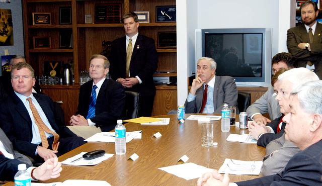 NASA image: KENNEDY SPACE CENTER, FLA. - NASA officials and government representatives are gathered to learn about the assets of the Central Florida Research Park, near Orlando.  At the far end of the table is NASA Administrator Sean O’Keefe.  He is flanked, on the left, by Florida Congressman Tom Feeney and U.S. Senator Bill Nelson; and on the right by U.S. Congressman Dave Weldon. Central Florida leaders are proposing the research park as the site for the NASA Shared Services Center.  The center would centralize NASA’s payroll, accounting, human resources, facilities and procurement offices that are now handled at each field center.  The consolidation is part of the One NASA focus.  Six sites around the U.S. are under consideration by NASA.