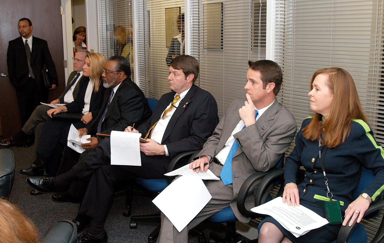 KENNEDY SPACE CENTER, FLA. - NASA and government officials are gathered to hear about the assets of the Central Florida Research Park, near Orlando, as the site of NASA’s new Shared Services Center.  Seated at right are Lisa Malone, director of KSC External Affairs, and Joel Wells, with the Government Relations Office.  Fourth from right is Jim Jennings, NASA deputy associate administrator for institutions and asset management. Six sites around the U.S. are under consideration for the center, which would centralize NASA’s payroll, accounting, human resources, facilities and procurement offices that are now handled at each field center.  The consolidation is part of the One NASA focus.