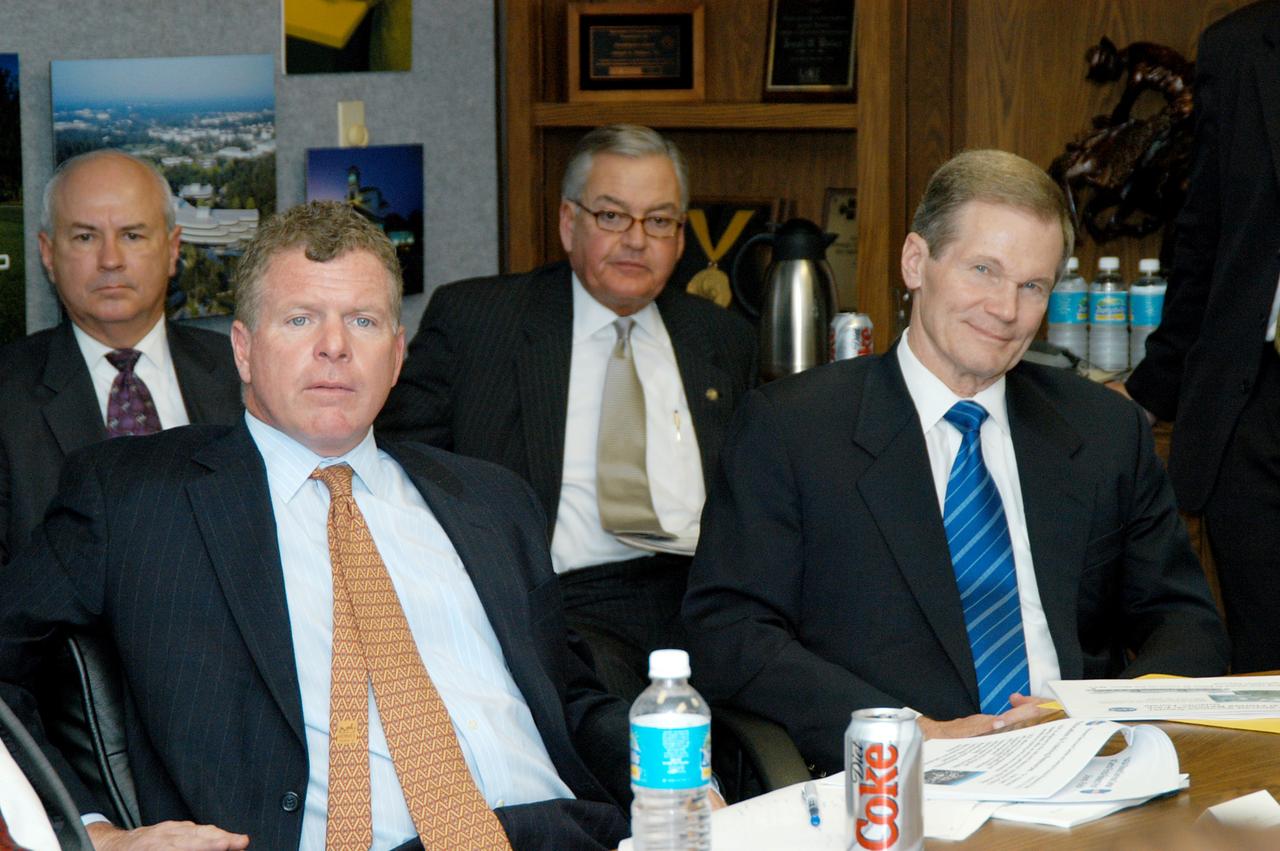 KENNEDY SPACE CENTER, FLA. - Florida Congressman Tom Feeney (left) and U.S. Senator Bill Nelson (right) listen to a presentation about the assets of the Central Florida Research Park, near Orlando, as the site of NASA’s new Shared Services Center.  Six sites around the U.S. are under consideration for location of the Center, which would centralize NASA’s payroll, accounting, human resources, facilities and procurement offices that are now handled at each field center.  The consolidation is part of the One NASA focus.  Others attending the presentation included Congressman Dave Weldon, U.S. Representative Ric Keller, Center Director Jim Kennedy and Pamella J. Dana, Ph.D., director, Office of Tourism, Trade, and Economic Development in Florida.