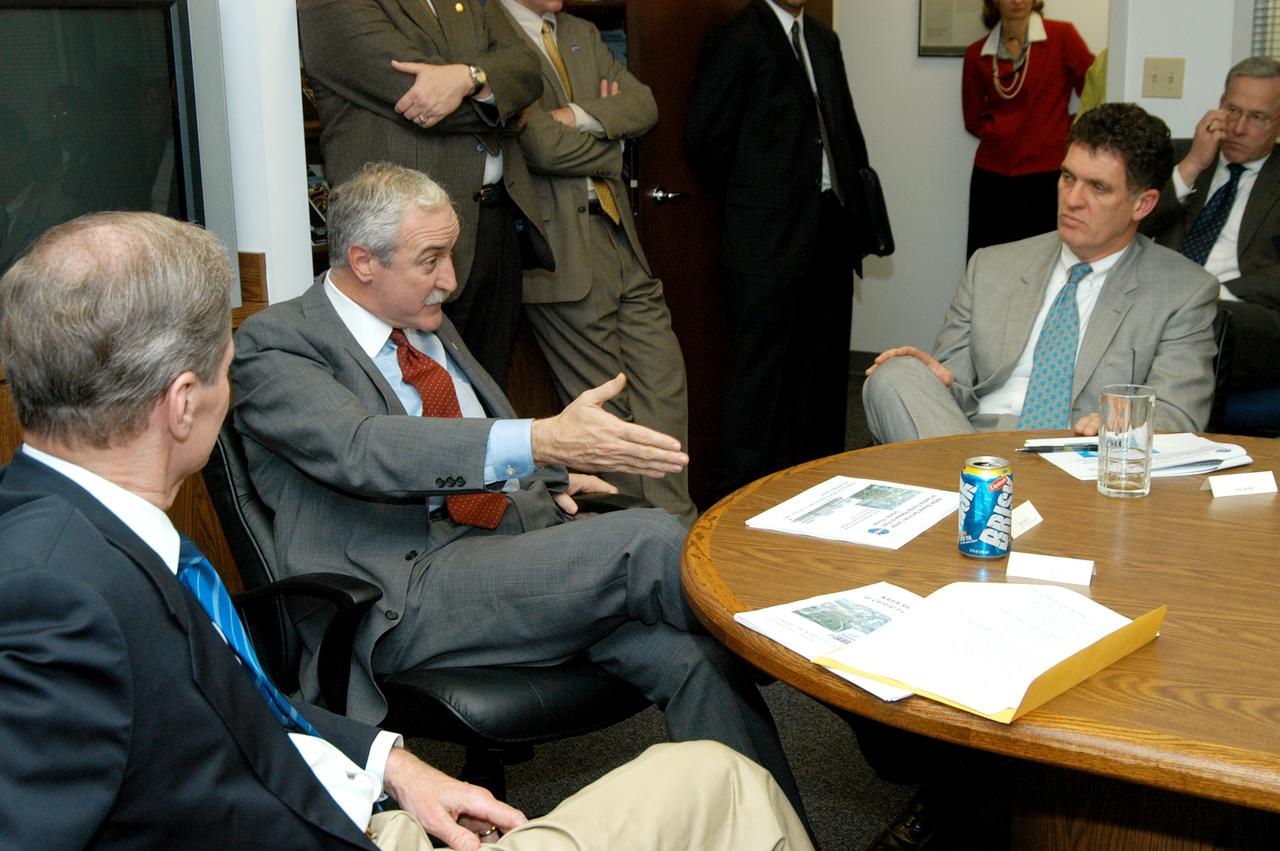 KENNEDY SPACE CENTER, FLA. - NASA Administrator Sean O’Keefe gestures during a discussion with Florida government leaders about the location for NASA’s new Shared Services Center. At left of O’Keefe is U.S. Senator Bill Nelson; at right is Congressman Dave Weldon.  Six sites around the U.S. are under consideration for location of the Center, which would centralize NASA’s payroll, accounting, human resources, facilities and procurement offices that are now handled at each field center.  The Florida location being proposed is of the Central Florida Research Park, near Orlando.  Others attending the presentation included Congressman Tom Feeney, U.S. Representative Ric Keller, Center Director Jim Kennedy and Pamella J. Dana, Ph.D., director, Office of Tourism, Trade, and Economic Development in Florida.
