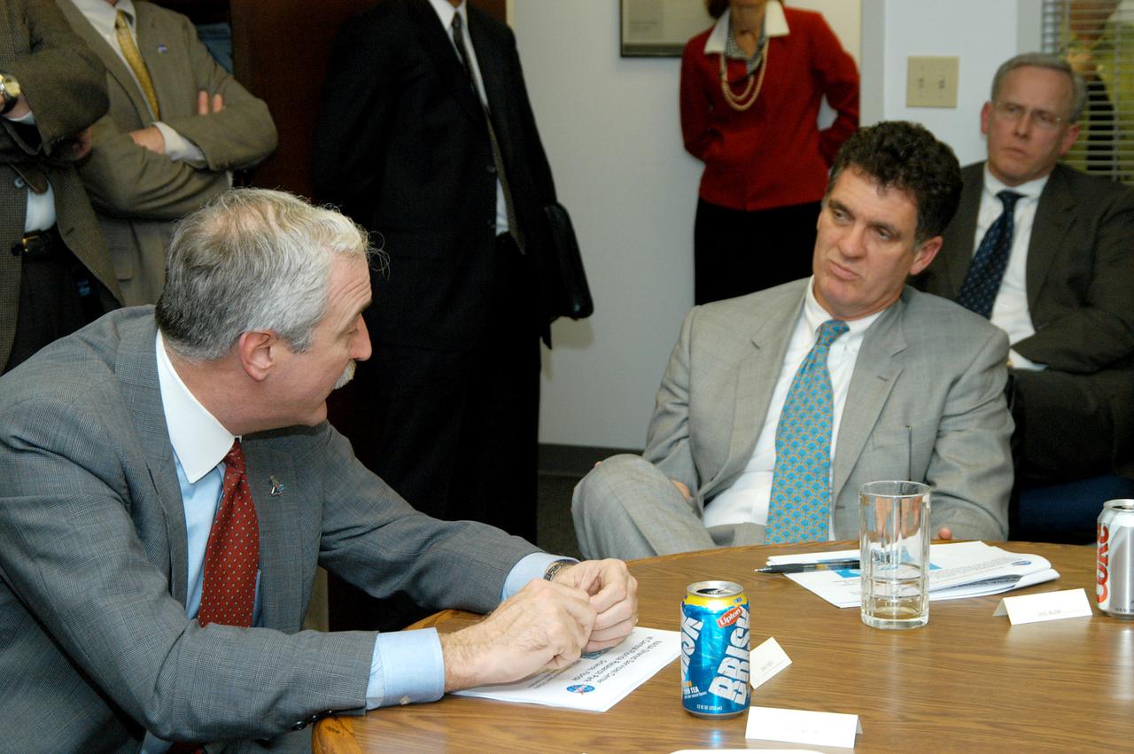 KENNEDY SPACE CENTER, FLA. - NASA Administrator Sean O’Keefe (left) talks with Congressman Dave Weldon (right) after a presentation about the assets of the Central Florida Research Park, near Orlando, as the site of NASA’s new Shared Services Center. Six sites around the U.S. are under consideration for location of the Center, which would centralize NASA’s payroll, accounting, human resources, facilities and procurement offices that are now handled at each field center.  The consolidation is part of the One NASA focus.  Others attending the presentation included Congressman Tom Feeney, U.S. Representative Ric Keller, U.S. Senator Bill Nelson, Center Director Jim Kennedy and Pamella J. Dana, Ph.D., director, Office of Tourism, Trade, and Economic Development in Florida.