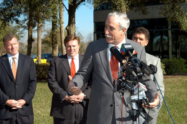 NASA image: KENNEDY SPACE CENTER, FLA. - NASA Administrator Sean O’Keefe talks to the media at the Central Florida Research Park, near Orlando.  He and government officials were at the park for a presentation about the assets of the research park as the site of NASA’s new Shared Services Center. Behind O’Keefe are (left to right) Florida Congressman Tom Feeney; U.S. Representative Ric Keller; and Congressman Dave Weldon.  Six sites around the U.S. are under consideration for location of the Center, which would centralize NASA’s payroll, accounting, human resources, facilities and procurement offices that are now handled at each field center.  The consolidation is part of the One NASA focus.  Others attending the presentation included  U.S. Senator Bill Nelson, Center Director Jim Kennedy and Pamella J. Dana, Ph.D., director, Office of Tourism, Trade, and Economic Development in Florida.