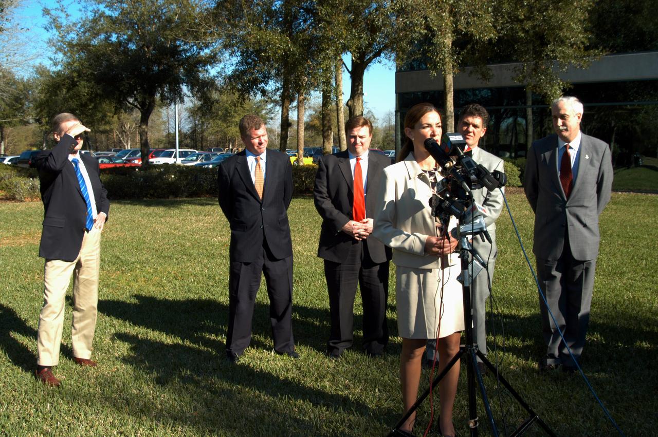 KENNEDY SPACE CENTER, FLA. - Pamella J. Dana, Ph.D., director, Office of Tourism, Trade, and Economic Development in Florida, talks to the media at the Central Florida Research Park, near Orlando.  She gave a presentation to NASA Administrator Sean O’Keefe (far right) about the assets of the research park as the site of NASA’s new Shared Services Center.  Behind Dana are (left to right) U.S. Senator Bill Nelson, Florida Congressman Tom Feeney; U.S. Representative Ric Keller; and Congressman Dave Weldon.  Six sites around the U.S. are under consideration for location of the Center, which would centralize NASA’s payroll, accounting, human resources, facilities and procurement offices that are now handled at each field center.  The consolidation is part of the One NASA focus.  Center Director Jim Kennedy also attended the presentation.