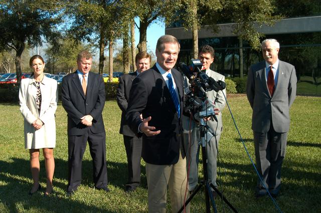 NASA image: KENNEDY SPACE CENTER, FLA. - U.S. Senator Bill Nelson talks to the media at the Central Florida Research Park, near Orlando.  He, NASA Administrator Sean O’Keefe and other government officials were at the park for a presentation about the assets of the research park as the site of NASA’s new Shared Services Center. Behind Nelson are (left to right) Pamella J. Dana, Ph.D., director, Office of Tourism, Trade, and Economic Development in Florida; Florida Congressman Tom Feeney; U.S. Representative Ric Keller; Congressman Dave Weldon and O’Keefe.  Six sites around the U.S. are under consideration for location of the Center, which would centralize NASA’s payroll, accounting, human resources, facilities and procurement offices that are now handled at each field center.  The consolidation is part of the One NASA focus.  Center Director Jim Kennedy also attended the presentation.