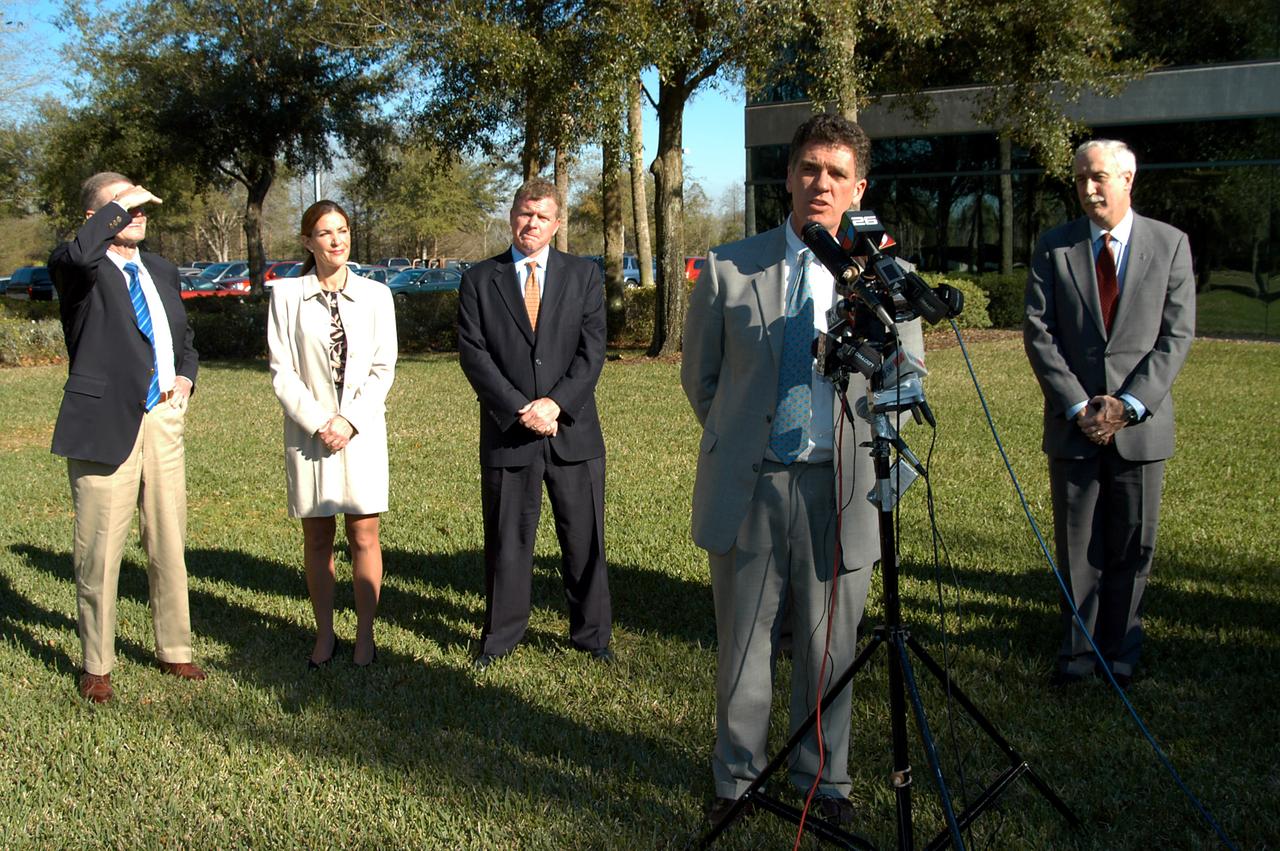 KENNEDY SPACE CENTER, FLA. - Congressman Dave Weldon talks to the media at the Central Florida Research Park, near Orlando.  He, NASA Administrator Sean O’Keefe and other government officials were at the park for a presentation about the assets of the research park as the site of NASA’s new Shared Services Center. Behind Weldon are (left to right) U.S. Senator Bill Nelson; Pamella J. Dana, Ph.D., director, Office of Tourism, Trade, and Economic Development in Florida; and Florida Congressman Tom Feeney; at right is O’Keefe.  Six sites around the U.S. are under consideration for location of the Center, which would centralize NASA’s payroll, accounting, human resources, facilities and procurement offices that are now handled at each field center.  The consolidation is part of the One NASA focus.  Center Director Jim Kennedy also attended the presentation.