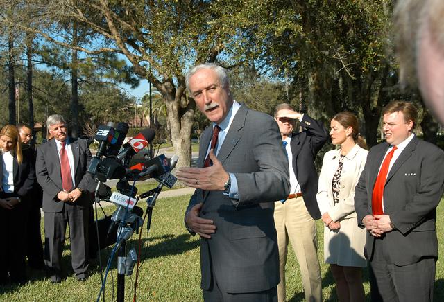 NASA image: KENNEDY SPACE CENTER, FLA. - NASA Administrator Sean O’Keefe talks to the media at the Central Florida Research Park, near Orlando.  He and government officials were at the park for a presentation about the assets of the research park as the site of NASA’s new Shared Services Center. On the left is Center Director Jim Kennedy.  On the right are U.S. Senator Bill Nelson; Pamella J. Dana, Ph.D., director, Office of Tourism, Trade, and Economic Development in Florida; and U.S. Representative Ric Keller . Six sites around the U.S. are under consideration for location of the Center, which would centralize NASA’s payroll, accounting, human resources, facilities and procurement offices that are now handled at each field center.  The consolidation is part of the One NASA focus.  Others attending the presentation included  Florida Congressman Tom Feeney and Congressman Dave Weldon.