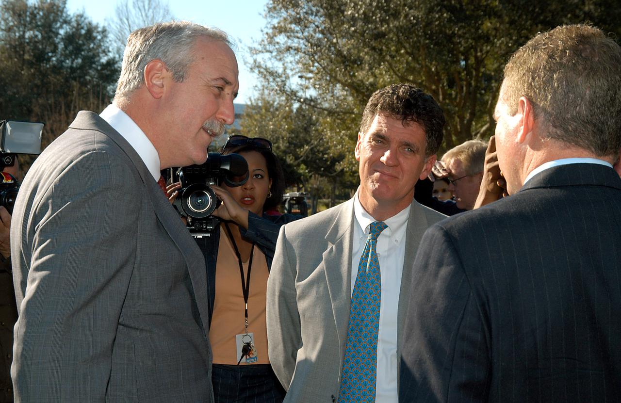 KENNEDY SPACE CENTER, FLA. - After talking to the media, NASA Administrator Sean O’Keefe (left) speaks to Congressman Dave Weldon (center) and Florida Congressman Tom Feeney (right).  O’Keefe and government officials were at the park for a presentation about the assets of the research park as the site of NASA’s new Shared Services Center. Six sites around the U.S. are under consideration for location of the Center, which would centralize NASA’s payroll, accounting, human resources, facilities and procurement offices that are now handled at each field center.  The consolidation is part of the One NASA focus.  Others attending the presentation included  U.S. Senator Bill Nelson, U.S. Representative Ric Keller, Center Director Jim Kennedy and Pamella J. Dana, Ph.D., director, Office of Tourism, Trade, and Economic Development in Florida.