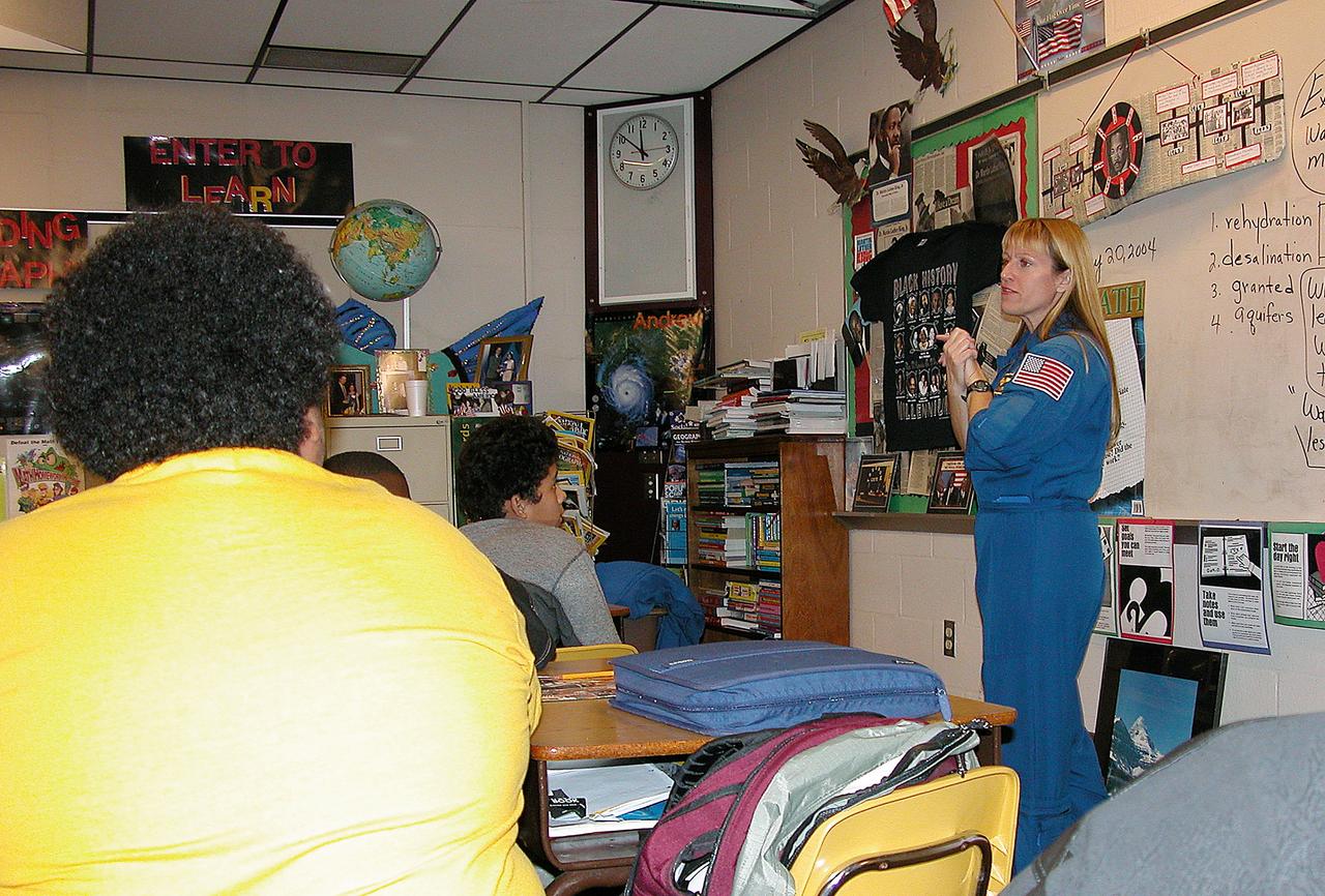 KENNEDY SPACE CENTER, FLA. - Astronaut Kay Hire talks to students in Garland V. Stewart Magnet Middle School, a NASA Explorer School (NES) in Tampa, Fla. She joined Center Director Jim Kennedy in sharing the agency’s new vision for space exploration with the next generation of explorers. Kennedy is talking with students about our destiny as explorers, NASA’s stepping stone approach to exploring Earth, the Moon, Mars and beyond, how space impacts our lives, and how people and machines rely on each other in space.