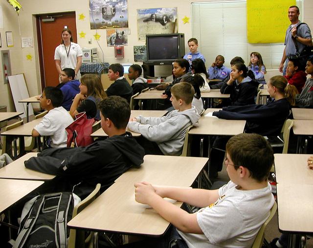 NASA image: KENNEDY SPACE CENTER, FLA. - Students at Garland V. Stewart Magnet Middle School, a NASA Explorer School (NES) in Tampa, Fla., listen attentively to astronaut Kay Hire.  She and Center Director Jim Kennedy were at the school to share the agency’s new vision for space exploration with the next generation of explorers. Kennedy is talking with students about our destiny as explorers, NASA’s stepping stone approach to exploring Earth, the Moon, Mars and beyond, how space impacts our lives, and how people and machines rely on each other in space.