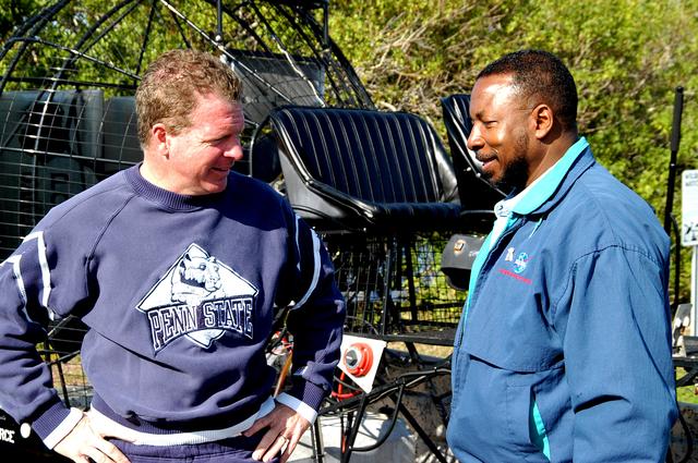 NASA image: KENNEDY SPACE CENTER, FLA. - Congressman Tom Feeney (left) and Deputy Director Woodrow Whitlow Jr. talk on the ground after completing an air boat ride around Kennedy Space Center.  During January and February, Congressman Feeney traveled the entire coastline of Florida’s 24th District, and concluded his walks March 1 in Brevard County.  On his walks, he met with constituents and community leaders to discuss legislative issues that will be addressed by the 108th Congress.  Feeney ended his beach walk at the KSC Visitor Complex main entrance.