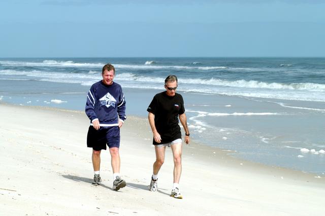 NASA image: KENNEDY SPACE CENTER, FLA. - Congressman Tom Feeney (left) walks along the beach at Kennedy Space Center.  Accompanying him is Ricky D. O’Quinn, a member of the KSC SWAT team. The congressman concluded his walks along the entire coastline of Florida’s 24th District March 1 on the beach at Kennedy Space Center. During his walks, he met with constituents and community leaders to discuss legislative issues that will be addressed by the 108th Congress.