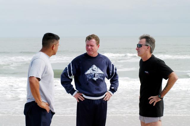 NASA image: KENNEDY SPACE CENTER, FLA. - Congressman Tom Feeney (center) pauses on his walk along the beach at Kennedy Space Center.  With him are Ivan Osores (left), with Security, and Ricky D. O’Quinn, with the KSC SWAT team.  During January and February, Congressman Feeney traveled the entire coastline of Florida’s 24th District, and concluded his walks March 1 in Brevard County.  On his walks, he met with constituents and community leaders to discuss legislative issues that will be addressed by the 108th Congress.