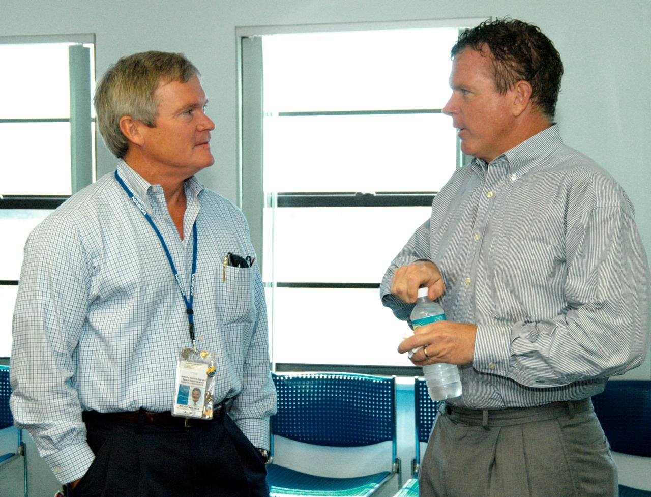 KENNEDY SPACE CENTER, FLA. - At the Beach House, Congressman Tom Feeney (right) talks with Bruce Melnick (left), vice president for Boeing Florida Operations at KSC. Feeney conducted a walk down the coastline of Florida’s 24th District on several days during January and February, concluding March 1 at Kennedy Space Center. On his walks, Feeney met with constituents and community leaders to discuss legislative issues that will be addressed by the 108th Congress.